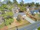Aerial shot showcasing the home's well-manicured lawn, long driveway and charming curb appeal at 3360 Pinewood Dr, Ladson, SC 29456