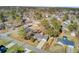 Aerial view of the home in a neighborhood with mature trees, lush landscape, and backyard at 3360 Pinewood Dr, Ladson, SC 29456