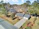 Aerial shot showcasing the home's well-manicured lawn, long driveway and charming curb appeal at 3360 Pinewood Dr, Ladson, SC 29456