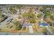 Aerial view of home displaying lush landscape, backyard, swimming pool and surrounding neighborhood at 3360 Pinewood Dr, Ladson, SC 29456