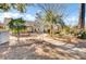 This backyard features mature trees and shrubbery, as well as a patio area at 3360 Pinewood Dr, Ladson, SC 29456