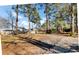 View of the backyard featuring mature trees, creating a serene and private outdoor space at 3360 Pinewood Dr, Ladson, SC 29456