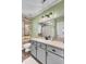 Charming bathroom with a modern light fixture and shiplap accent wall at 3360 Pinewood Dr, Ladson, SC 29456