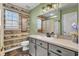 Charming bathroom with a modern light fixture and shiplap accent wall at 3360 Pinewood Dr, Ladson, SC 29456