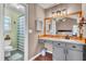 Bathroom featuring a vanity, wood floors, and a large mirror with a wood trim at 3360 Pinewood Dr, Ladson, SC 29456