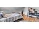 This bedroom features warm toned wood floors and neutral paint on the walls at 3360 Pinewood Dr, Ladson, SC 29456