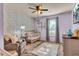 Bright Bedroom with stylish decor, a crib, and a cozy chair at 3360 Pinewood Dr, Ladson, SC 29456