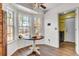 Bright breakfast nook featuring a pedestal table, three windows, and wood-look flooring at 3360 Pinewood Dr, Ladson, SC 29456