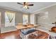 Bright dining room with wood floors, a ceiling fan, and ample space for entertaining guests at 3360 Pinewood Dr, Ladson, SC 29456
