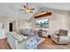 Bright living room featuring vaulted ceilings, fan, modern furniture, and a wall-mounted TV at 3360 Pinewood Dr, Ladson, SC 29456