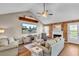 Cozy living room with wood floors, fireplace, and a vaulted ceiling at 3360 Pinewood Dr, Ladson, SC 29456