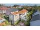 Aerial view of a charming house with a backyard patio and lush greenery in a vibrant neighborhood setting at 36 Bogard St, Charleston, SC 29403