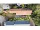 Aerial view of a home featuring a cozy patio, lush garden, and well-maintained roof in a vibrant neighborhood at 36 Bogard St, Charleston, SC 29403