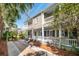 Back exterior featuring a multi-level porch with a white railing at 36 Bogard St, Charleston, SC 29403