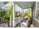 Inviting back porch featuring classic columns and lush greenery at 36 Bogard St, Charleston, SC 29403
