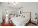 Bright bedroom with wooden floors features a vanity and ensuite bathroom at 36 Bogard St, Charleston, SC 29403