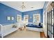 Bedroom featuring blue walls and white furniture, with natural light at 36 Bogard St, Charleston, SC 29403