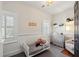 Bedroom with neutral colors and a toddler bed with natural light at 36 Bogard St, Charleston, SC 29403