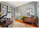 Home office with built-in bookshelves, hardwood floors, and a vintage-style desk at 36 Bogard St, Charleston, SC 29403