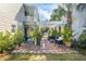 Charming patio with brick flooring, pergola cover, and manicured lawn offer a cozy outdoor living space at 36 Bogard St, Charleston, SC 29403