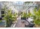 Inviting patio area with brick flooring, comfortable seating, and a stylish pergola overhead, ideal for gatherings at 36 Bogard St, Charleston, SC 29403