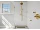 Bright bathroom featuring a glass shower with gold showerhead and hardware at 36 Bogard St, Charleston, SC 29403