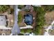 Aerial view of a well-maintained home featuring pristine landscaping, a circular driveway and mature trees at 3711 Riverstation Ct, Mount Pleasant, SC 29466