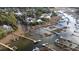 Expansive aerial view of waterfront homes and private boat docks along winding marsh waterways at 3711 Riverstation Ct, Mount Pleasant, SC 29466