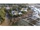 Aerial view of a charming waterfront neighborhood with lush greenery and winding boardwalk at 3711 Riverstation Ct, Mount Pleasant, SC 29466