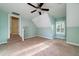 Neutral bedroom with sloped ceilings, plenty of light and access to a doorway at 3711 Riverstation Ct, Mount Pleasant, SC 29466