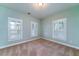 Bright bedroom with neutral carpet, white trim and many windows at 3711 Riverstation Ct, Mount Pleasant, SC 29466