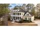 Charming two-story home features a welcoming porch, complemented by mature landscaping and traditional details at 3711 Riverstation Ct, Mount Pleasant, SC 29466
