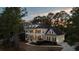 Stately two-story home with welcoming front porch, complemented by mature landscaping and traditional details at 3711 Riverstation Ct, Mount Pleasant, SC 29466