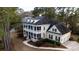 Two-story home boasts a welcoming front porch, classic design elements, and well-kept grounds at 3711 Riverstation Ct, Mount Pleasant, SC 29466