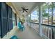 Spacious front porch with columns, ceiling fans, and comfortable seating at 3711 Riverstation Ct, Mount Pleasant, SC 29466