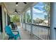 Inviting porch with white columns and black railings and serene neighborhood views at 3711 Riverstation Ct, Mount Pleasant, SC 29466