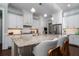 Spacious kitchen featuring a granite island, stainless steel appliances, and white cabinetry at 3711 Riverstation Ct, Mount Pleasant, SC 29466