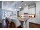 Bright kitchen with granite countertops, white cabinets, and modern pendant lighting at 3711 Riverstation Ct, Mount Pleasant, SC 29466