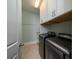 Functional laundry room featuring modern washer and dryer, granite counters and ample cabinet space at 3711 Riverstation Ct, Mount Pleasant, SC 29466