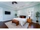 Bright, spacious main bedroom featuring tray ceilings, a sitting area, and plentiful natural light at 3711 Riverstation Ct, Mount Pleasant, SC 29466