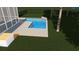 An overview of the T-shaped pool with sun deck, covered porch, and backyard lawn at 3711 Riverstation Ct, Mount Pleasant, SC 29466