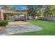 View of spacious back yard showing covered patio, storage shed and back yard fence at 409 Dowling Ave, Walterboro, SC 29488