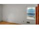 Bright bedroom with hardwood floors, window view, fresh paint, and natural light at 409 Dowling Ave, Walterboro, SC 29488