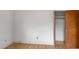Clean bedroom featuring hardwood floors, fresh paint, and a closet for storage at 409 Dowling Ave, Walterboro, SC 29488