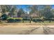 Traditional brick home featuring a quaint front porch and well-maintained yard with a brick and post fence at 409 Dowling Ave, Walterboro, SC 29488