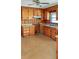 Cozy kitchen with wood paneling, cabinets, and plenty of storage space at 409 Dowling Ave, Walterboro, SC 29488