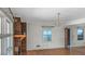 Bright living room featuring hardwood floors, fireplace, and ample natural light at 409 Dowling Ave, Walterboro, SC 29488