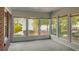 Sunroom with multiple windows and views of the outside landscape and backyard at 409 Dowling Ave, Walterboro, SC 29488