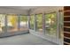 Bright sunroom with many windows, paneling, and views of the surrounding yard at 409 Dowling Ave, Walterboro, SC 29488