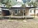 Back porch with wooden deck and built-in bar area at 411 Maplewood Dr, Walterboro, SC 29488
